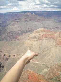 grand canyon reaching hand